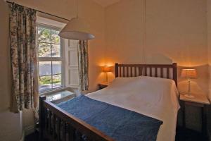 a bedroom with a bed and a window at 4 Bed in Renvyle oc-i258 in Salrock