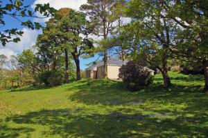 a house on a hill with trees and grass at 4 Bed in Renvyle oc-i258 in Salrock