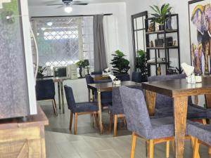 a dining room with a table and chairs at 2 VENATOR House Boutique in León +11 photos