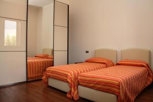 Un pat sau paturi într-o cameră la Affittacamere Bellavista