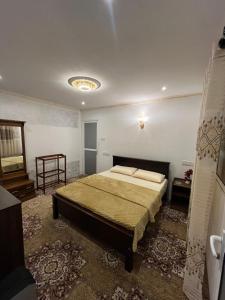a bedroom with a large bed in a room at CHILLY CHALET Cabana in Nuwara Eliya