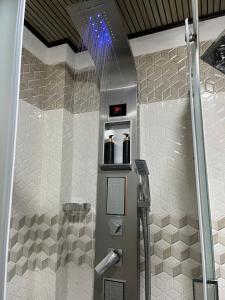a shower stall in a bathroom with aperature at CHILLY CHALET Cabana in Nuwara Eliya