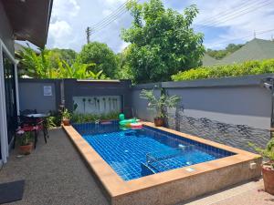 a swimming pool in the backyard of a house at Peaceful Pool Villa 1 in Ao Nang Beach