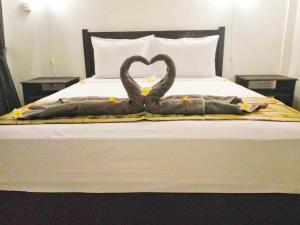 Postel nebo postele na pokoji v ubytování Akalanka Homestay