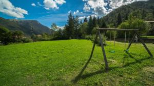 a goal in a field with mountains in the background at Casa al Portico in Ledro +2 photos