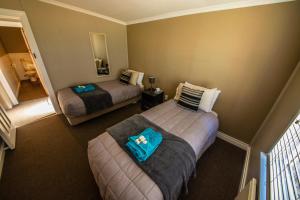 Säng eller sängar i ett rum på Waipiata Country Hotel