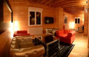 a living room with a couch and two chairs at Domaine du Mont Monnet - Chambre d'hôtes & Gîte in Longes