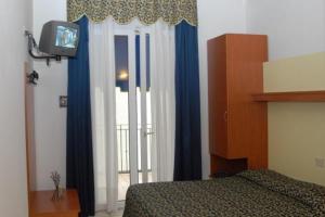 Posteľ alebo postele v izbe v ubytovaní Hotel Lido