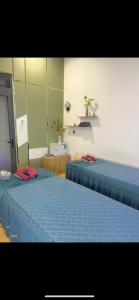 two beds sitting next to each other in a room at Valley homestay Dalat in Da Thien +14 photos