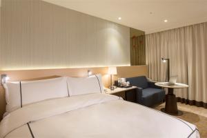 Postel nebo postele na pokoji v ubytování K Hotel Tianjin
