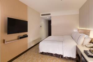 TV a/nebo společenská místnost v ubytování K Hotel Tianjin