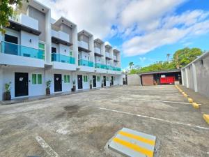 an empty parking lot in front of a building at J Spazio Apartelle and Cafe in Baranghauon