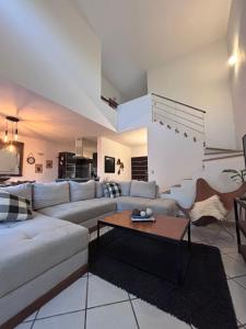 a living room with a couch and a table at Vacation Villa Marina in Puerto Vallarta