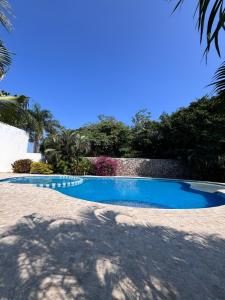 a swimming pool in the middle of a yard at Vacation Villa Marina in Puerto Vallarta