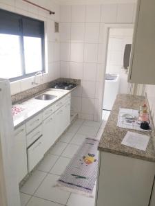 Una cocina o zona de cocina en Apartamento Balneário Camboriú