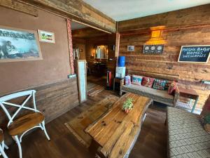 an overhead view of a living room in a log cabin at MeenaBagh Villa Rooms & Cafe in Shimla