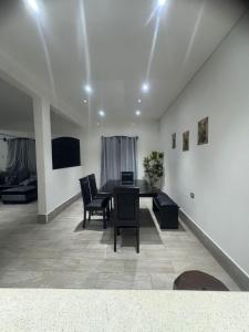 a living room with a dining room table and chairs at Casa KM222 in Esquipulas