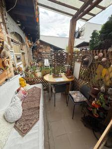 a small patio with a table and a table and a tableablish at Levendula ház Vác in Vác