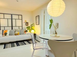 a living room with a couch and a table at Hongdae 10 min Family 2BR Direct Airport Bus from ICN airport in Seoul