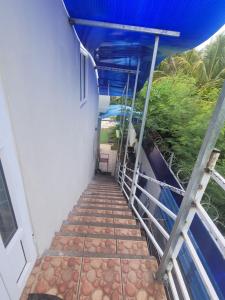 a stairway leading to a balcony on a cruise ship at Blue Horizon Villa in Grand Baie in Grand-Baie