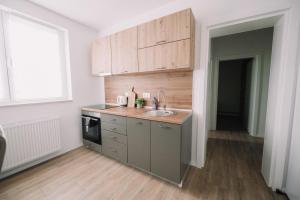a kitchen with a sink and a counter top at KDolićiM in Livno +14 photos