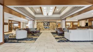 a lobby with couches and chairs at DoubleTree by Hilton Pittsburgh-Green Tree in Pittsburgh