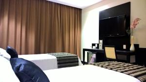 Hotel Atlântico Tower客房内的一张或多张床位