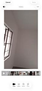 ein Screenshot eines Fernsehbildschirms mit einem Fenster in der Unterkunft Zaragosa in Bulakan + 3 Fotos