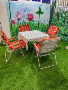 a table and two chairs and a table and chairs at Wiwi Appartement in Kinshasa