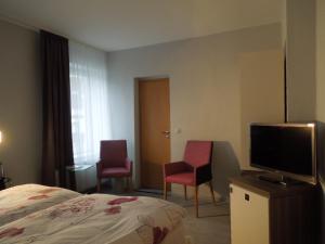 TV a/nebo společenská místnost v ubytování Hotel Gode Wind