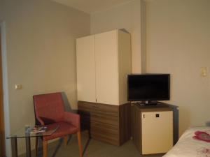 TV a/nebo společenská místnost v ubytování Hotel Gode Wind