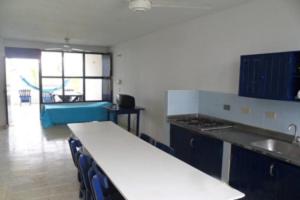 a kitchen with a counter top and a sink at Apartamentos Las Múcuras in Coveñas
