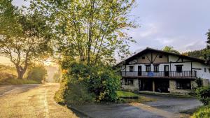 a house on the side of a road at Albergue Gerekiz AMAGI, exclusivo peregrinos in Flores