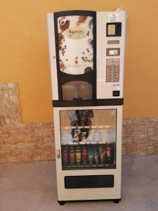a refrigerator with a drink inside of it at Villa Porto fossa in Marzamemi