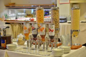 a table topped with glasses of wine and food at Hotel Luna in Sirmione +50 photos