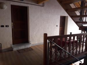 an empty room with a staircase and a door at Appartamento" Le Bourg 61" VDA CIR 0208 in Aosta