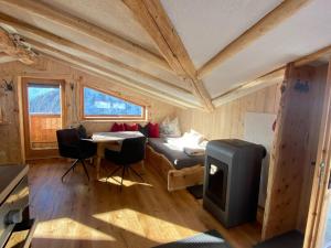 a bedroom with a bed and a tv in a room at Chalet in Zillertal near Hochzillertal Ski Area in Zellberg