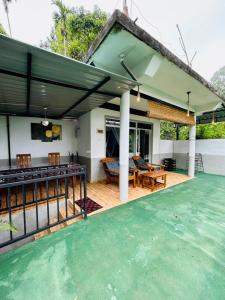 an image of a house with a tennis court at The Bliss Homestay in Ella