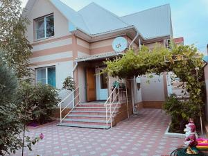 a house with a staircase in front of it at Full relax in Zatoka