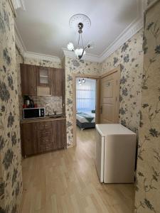 a kitchen with a refrigerator in a room at Ramonun Yeri in Istanbul