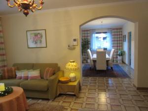 a living room with a couch and a table at Appartement-Heuberg in Salzburg