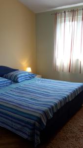 Postel nebo postele na pokoji v ubytování Apartment Ivo