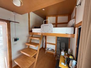 a small room with a bunk bed in a tiny house at Bird Nest in Ko Tao +59 photos