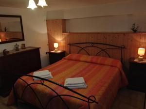 מיטה או מיטות בחדר ב-B&B La Magnolia