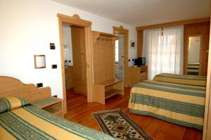 Postel nebo postele na pokoji v ubytování Hotel Sport