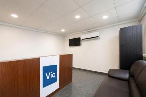 a conference room with a vico sign on the wall at Via The Akshardham Bliss - LAXMI NAGAR METRO in New Delhi