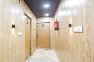 a hallway with a fire extinguisher on the wall at Via The Akshardham Bliss - LAXMI NAGAR METRO in New Delhi