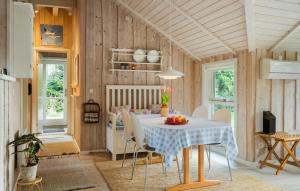 a dining room with a table and chairs at Awesome Home In Ulfborg With Wifi in Ulfborg
