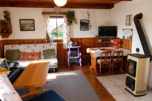 a living room with a couch and a table at Chata Růžová in Růžová