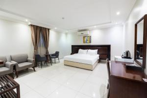 Легло или легла в стая в Taleen Serviced Apartments Al Aqiq- تالين العقيق للشقق المخدومة + 35 снимки